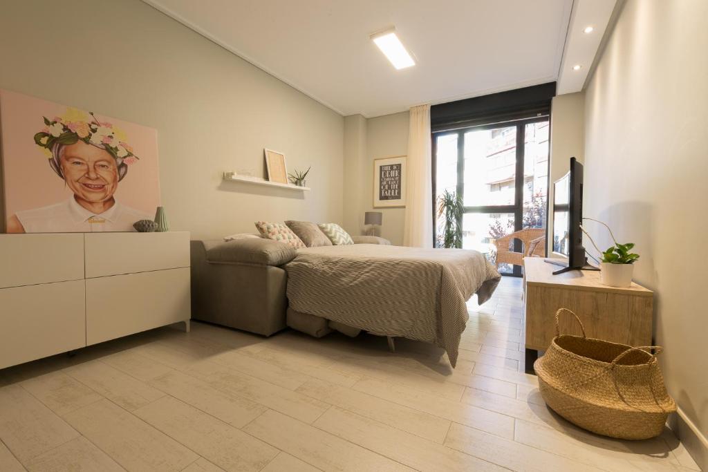 Кровать или кровати в номере Apartamentos Inloft