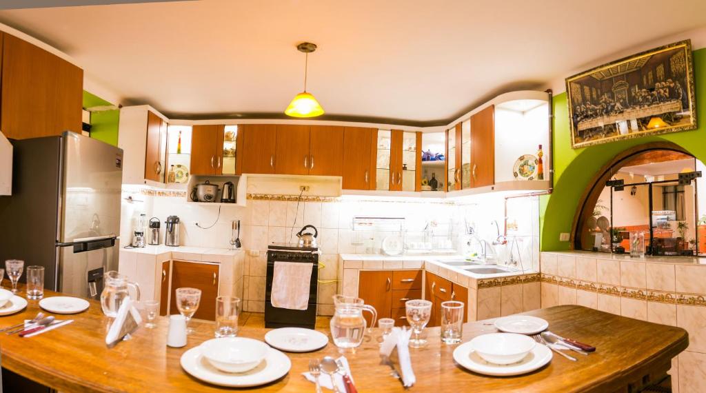 A kitchen or kitchenette at Hotel Los Laureles