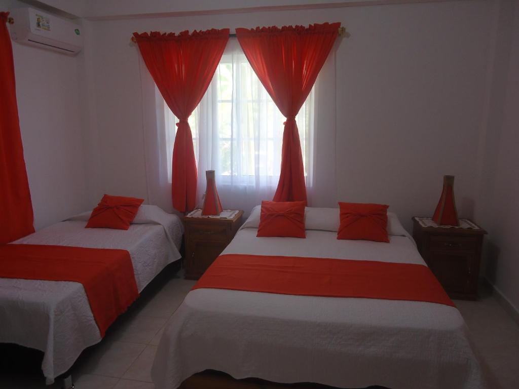 Postel nebo postele na pokoji v ubytování Posada Sunshine Paradise