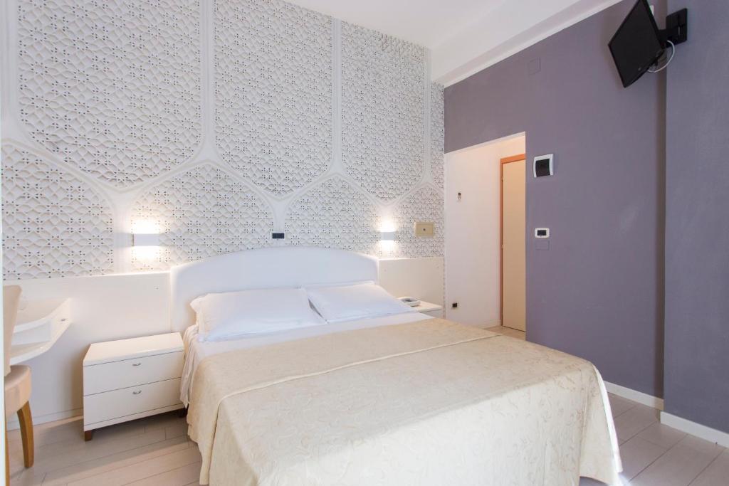 Postel nebo postele na pokoji v ubytování Sirena Boutique Hotel