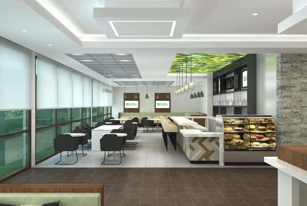 a rendering of a restaurant with tables and chairs at Wyndham Garden Ft Lauderdale Airport & Cruise Port in Dania Beach