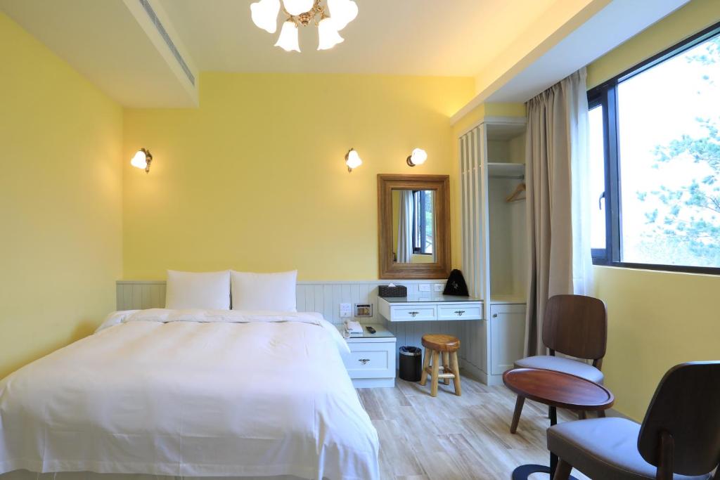Postel nebo postele na pokoji v ubytování Yo Shen Jing Resorts