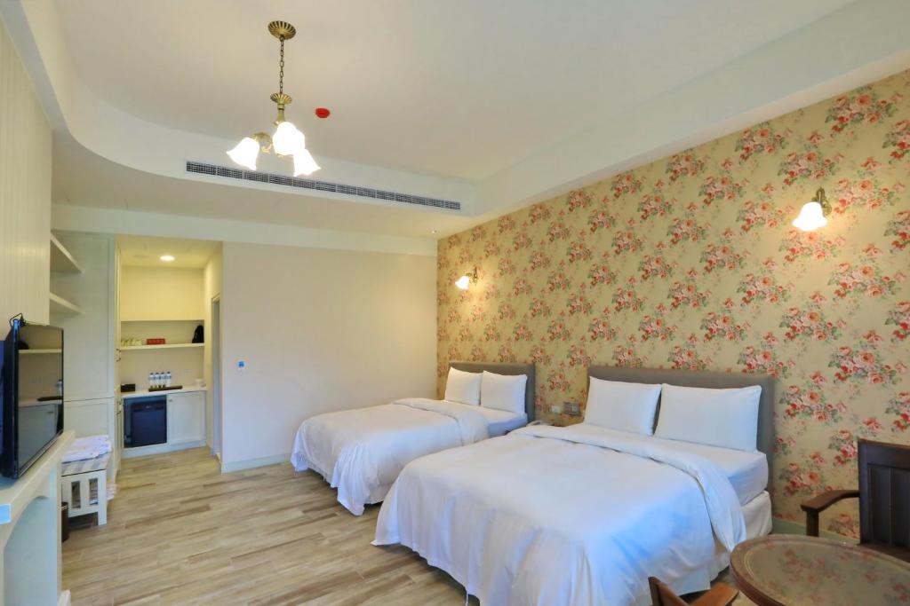 Postel nebo postele na pokoji v ubytování Yo Shen Jing Resorts
