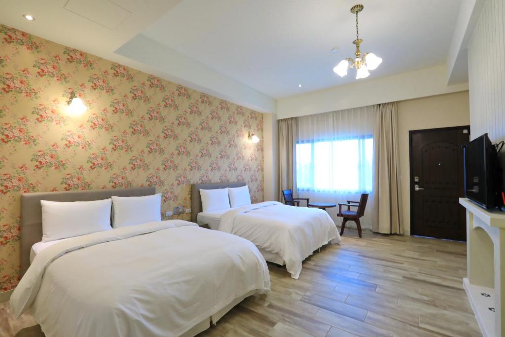 Postel nebo postele na pokoji v ubytování Yo Shen Jing Resorts