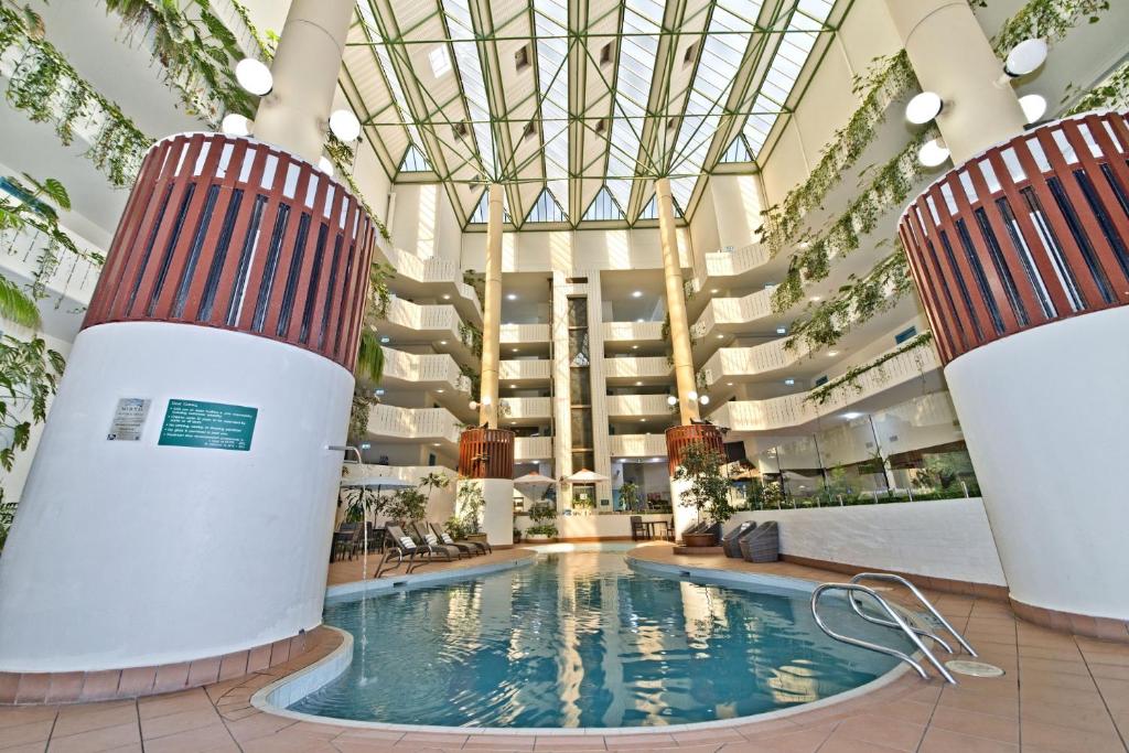 a pool in therium of a hotel at Atrium Hotel Mandurah in Mandurah