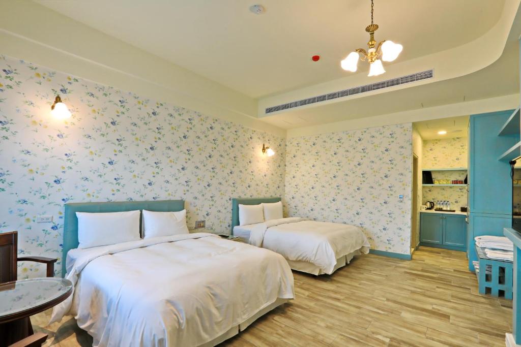Postel nebo postele na pokoji v ubytování Yo Shen Jing Resorts
