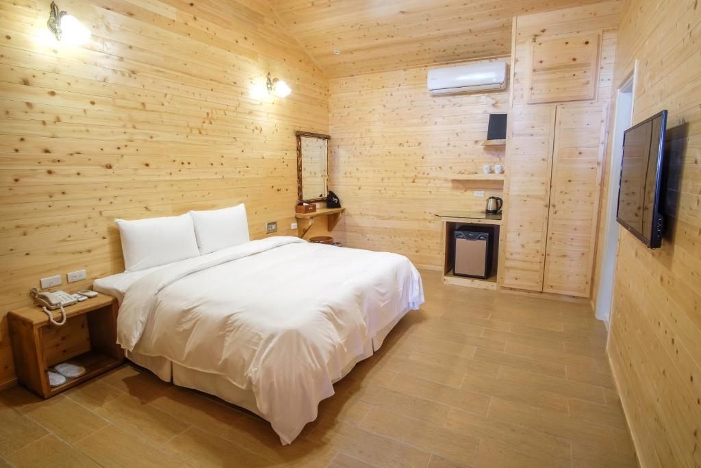 Postel nebo postele na pokoji v ubytování Yo Shen Jing Resorts