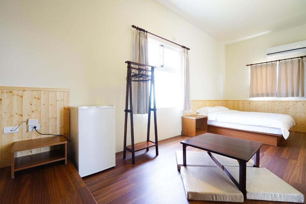 Postel nebo postele na pokoji v ubytování Penghu Sun House