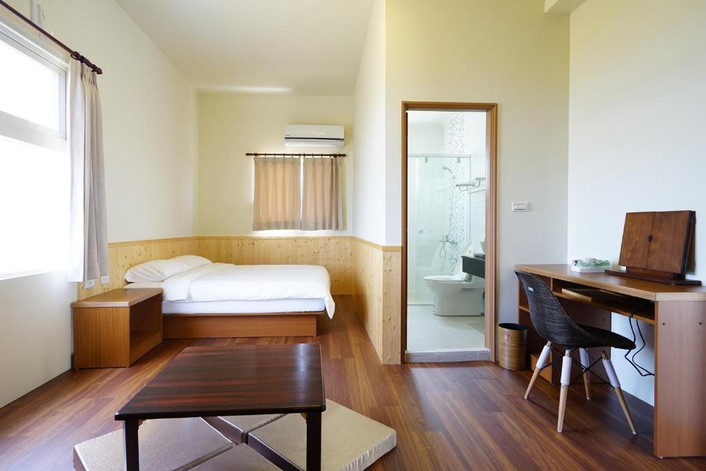 Postel nebo postele na pokoji v ubytování Penghu Sun House