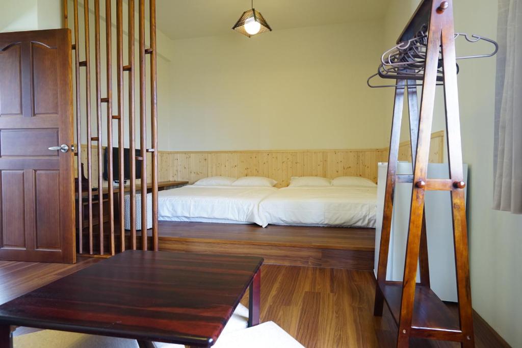 Postel nebo postele na pokoji v ubytování Penghu Sun House