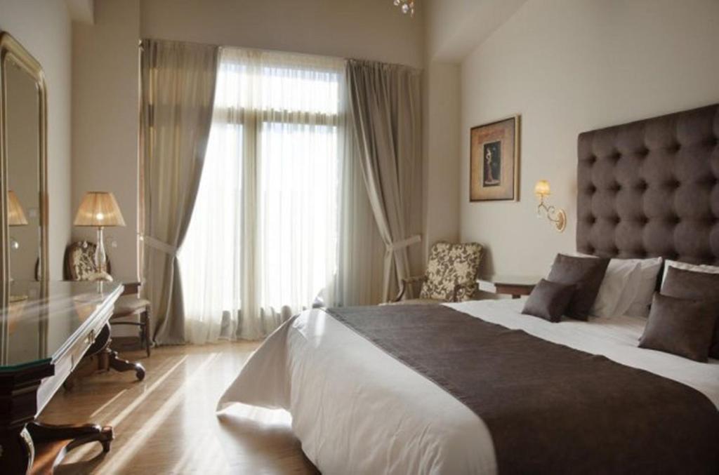 Postel nebo postele na pokoji v ubytování Tagli Resort & Villas
