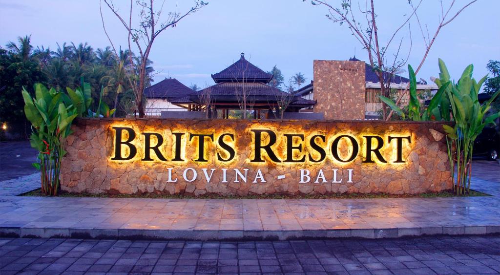 a sign that says birds resort in front of a building at Brits Resort Lovina in Lovina