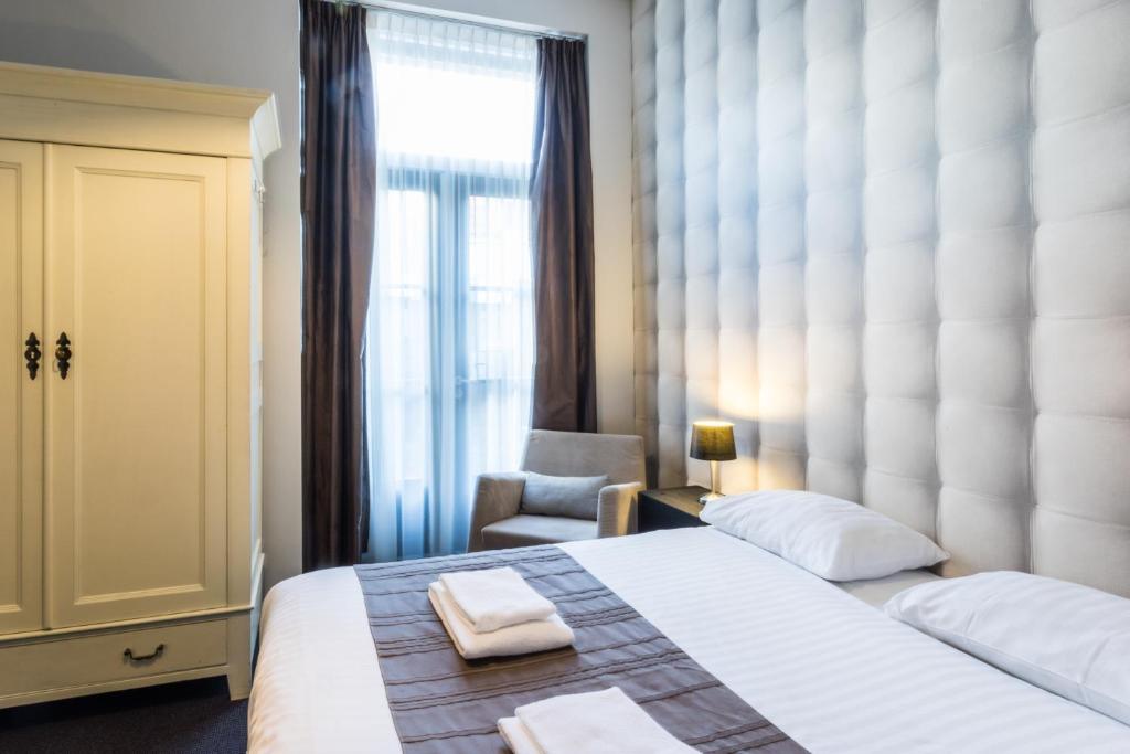 Postel nebo postele na pokoji v ubytování Hotel Zilt