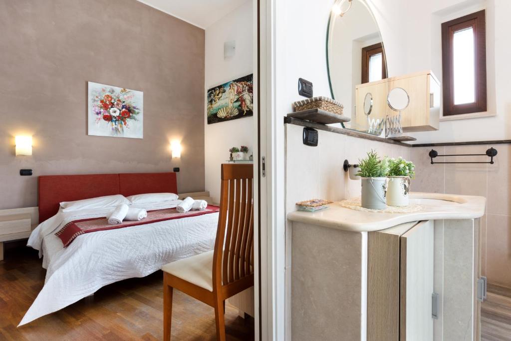 Posteľ alebo postele v izbe v ubytovaní B&B Ortigia Bedda