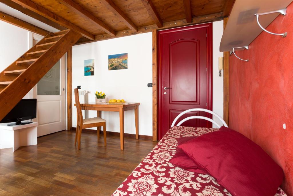 Televízia a/alebo spoločenská miestnosť v ubytovaní B&B Ortigia Bedda