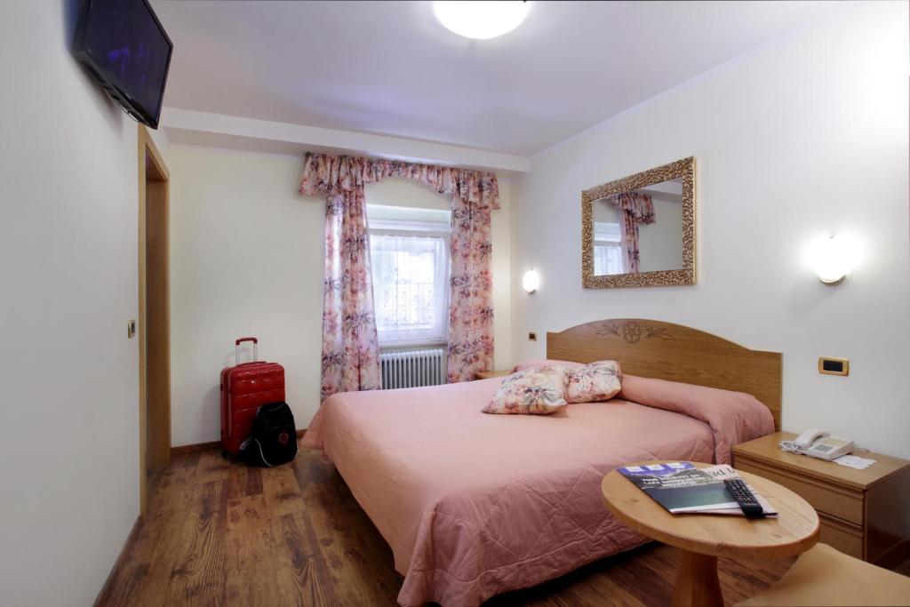 Postel nebo postele na pokoji v ubytování Hotel Olympia