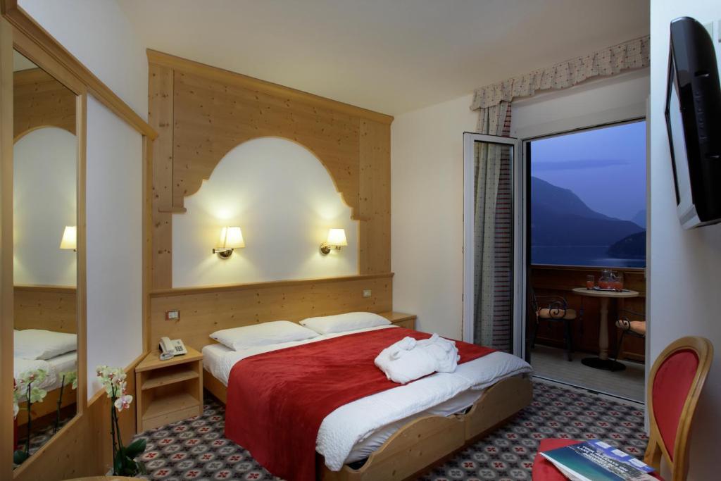 Postel nebo postele na pokoji v ubytování Hotel Olympia