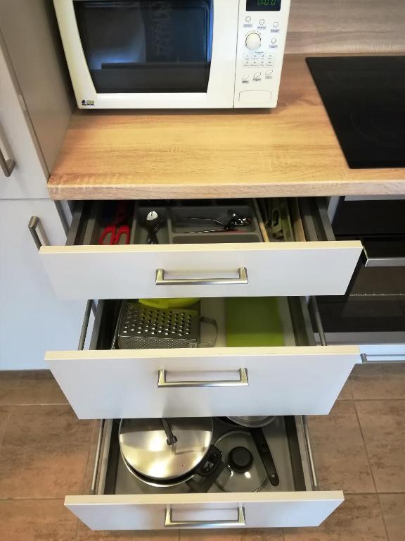 Kuchyň nebo kuchyňský kout v ubytování Apartment Promenada