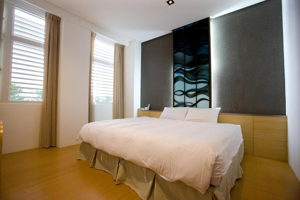Postel nebo postele na pokoji v ubytování Zhi Da Craft Service Guest House