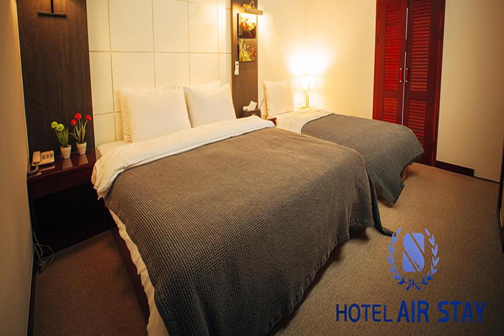 Postel nebo postele na pokoji v ubytování Incheon Airporthotel Airstay
