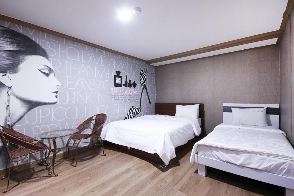 Postel nebo postele na pokoji v ubytování Happy Q Motel