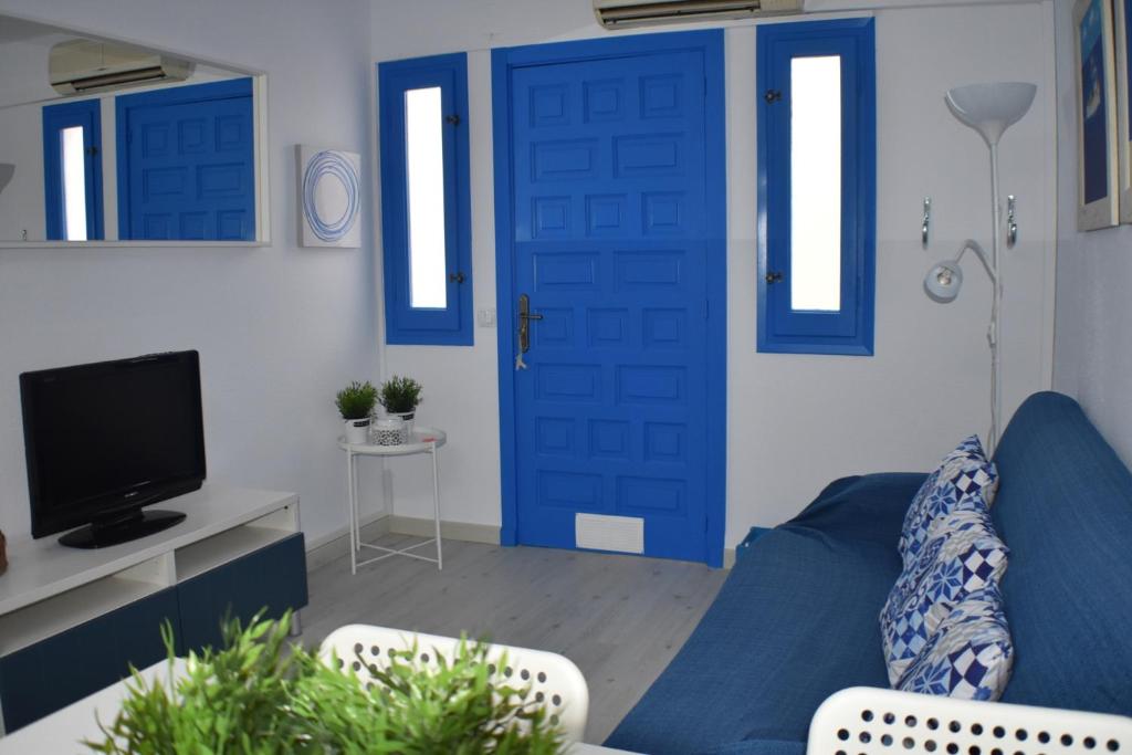 Televízia a/alebo spoločenská miestnosť v ubytovaní Apartament Virginia