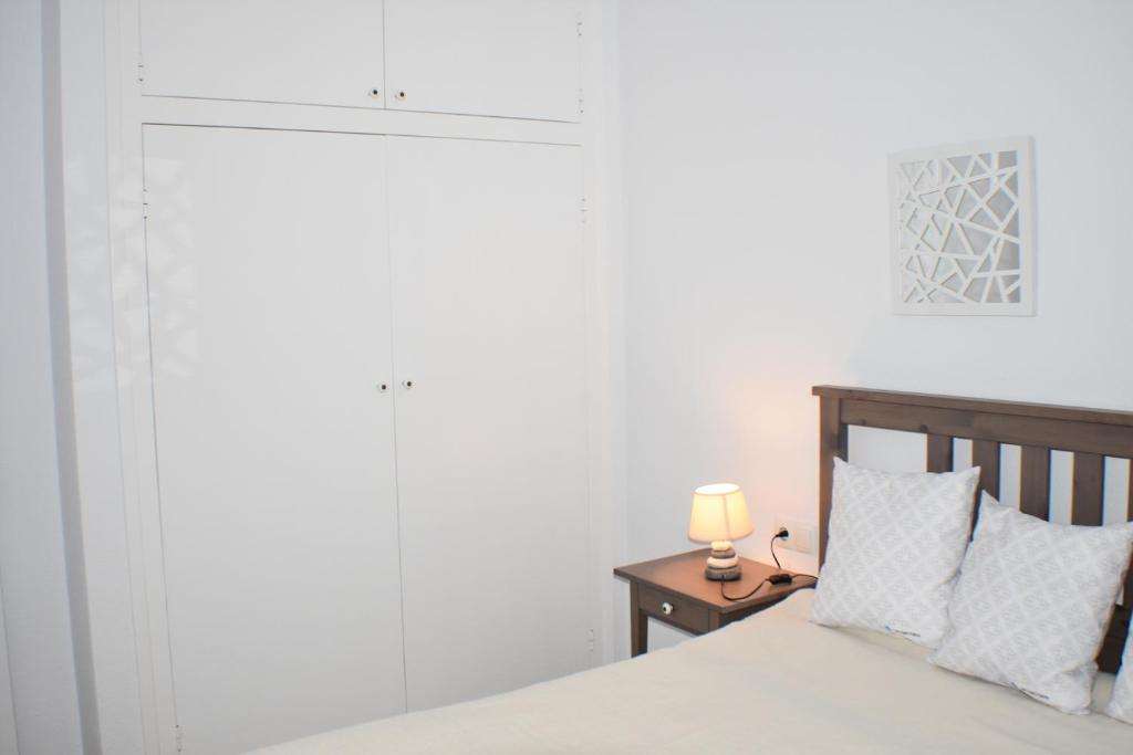 Posteľ alebo postele v izbe v ubytovaní Apartament Virginia