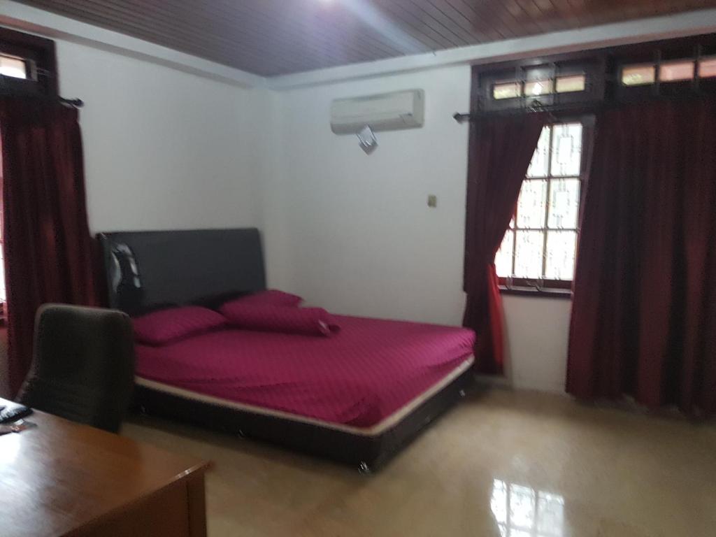 Postel nebo postele na pokoji v ubytování Mayestik Guest House Syariah