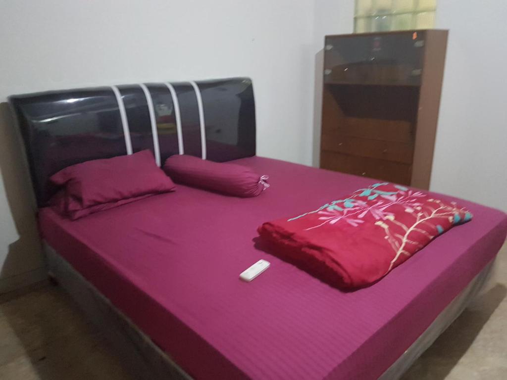 Postel nebo postele na pokoji v ubytování Mayestik Guest House Syariah