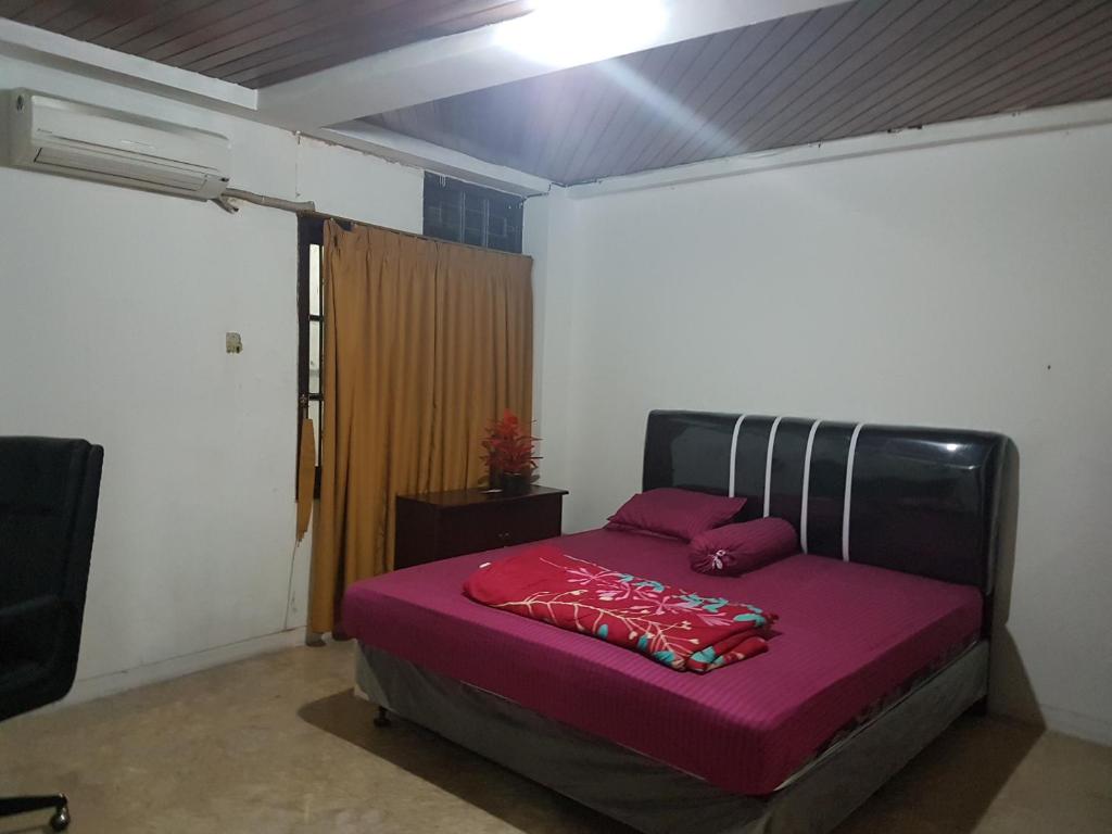 Postel nebo postele na pokoji v ubytování Mayestik Guest House Syariah