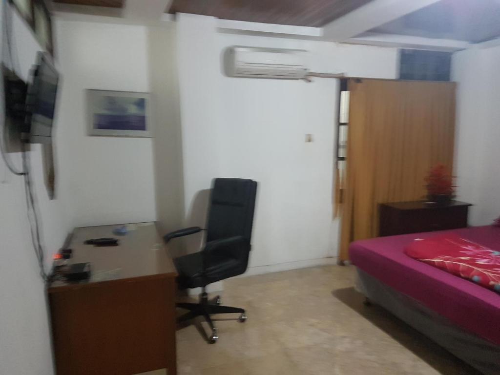 Postel nebo postele na pokoji v ubytování Mayestik Guest House Syariah
