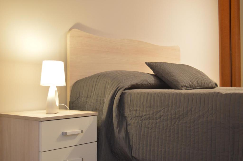 Uma cama ou camas num quarto em B&B Scalea Rooms