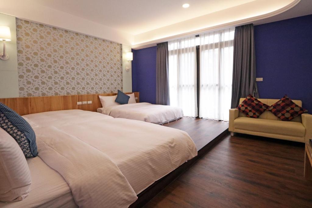Postel nebo postele na pokoji v ubytování Penghu Little Apple B&B