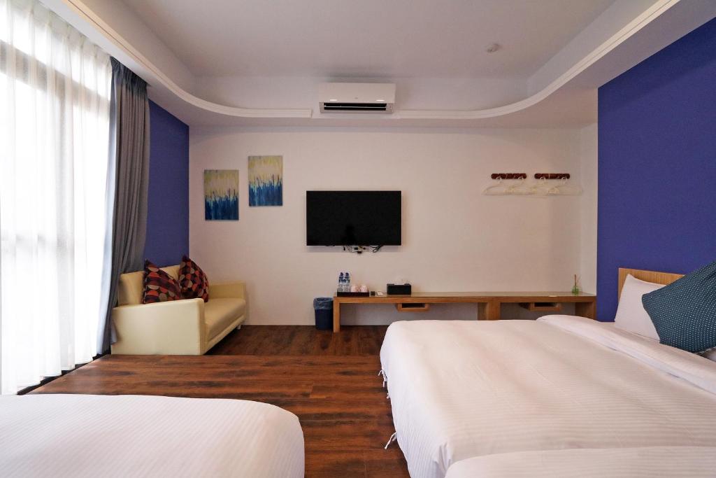 TV a/nebo společenská místnost v ubytování Penghu Little Apple B&B