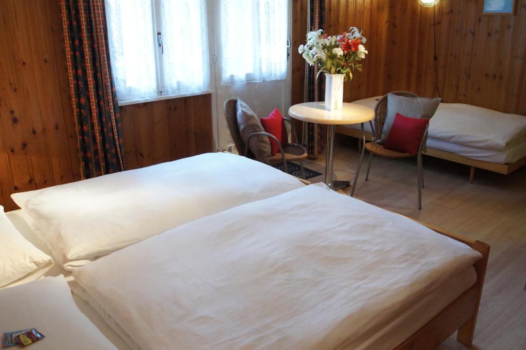 Postel nebo postele na pokoji v ubytování Hotel Alpina