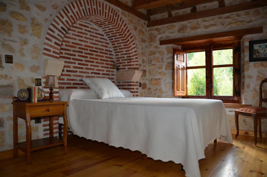 Postel nebo postele na pokoji v ubytování Casa Rural El Covanchón