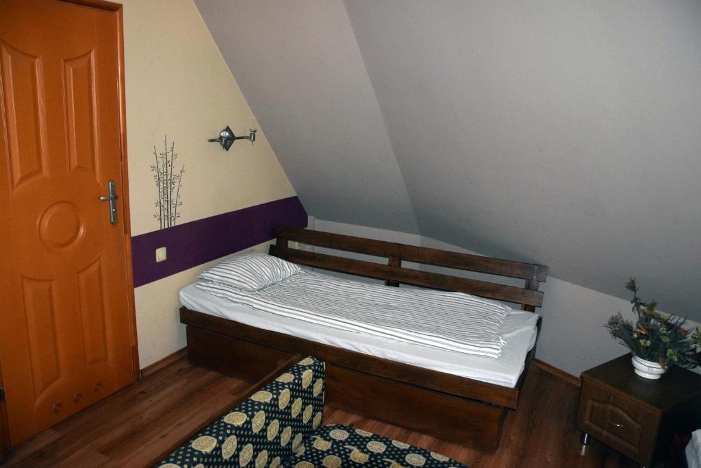 
Łóżko lub łóżka w pokoju w obiekcie Pensjonat Europa
