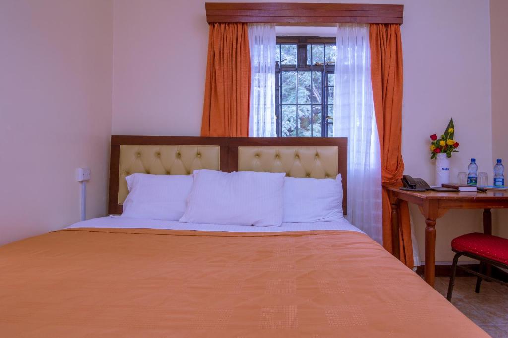 Postel nebo postele na pokoji v ubytování Chak Guesthouse & Conference Center