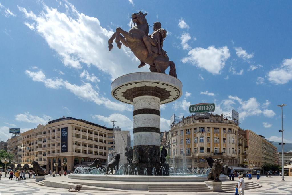 a statue of a horse and rider on top of a fountain at Apartment Buzarovski in Skopje