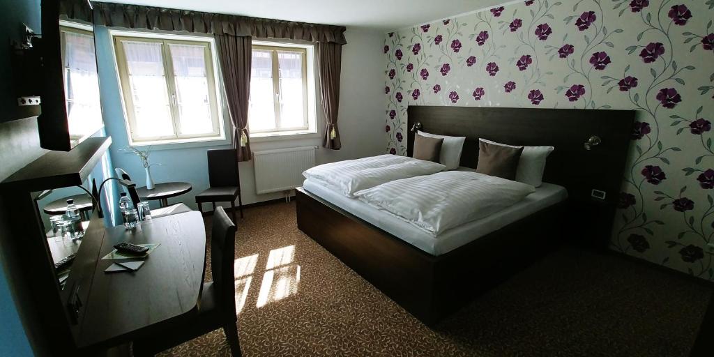 Postel nebo postele na pokoji v ubytování Hotel Alte Brennerei