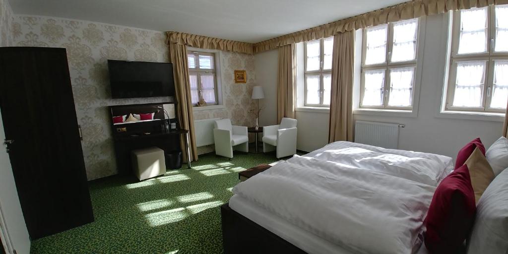 Postel nebo postele na pokoji v ubytování Hotel Alte Brennerei