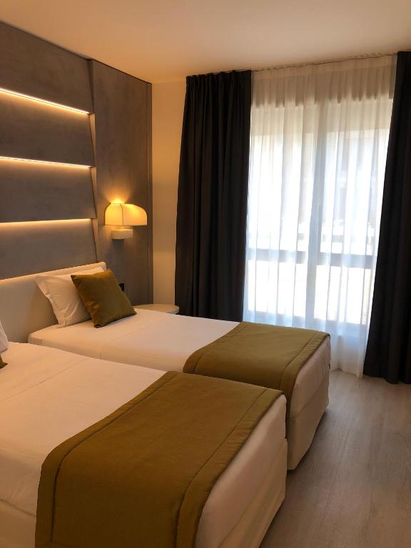 Postel nebo postele na pokoji v ubytování La Pieve Hotel