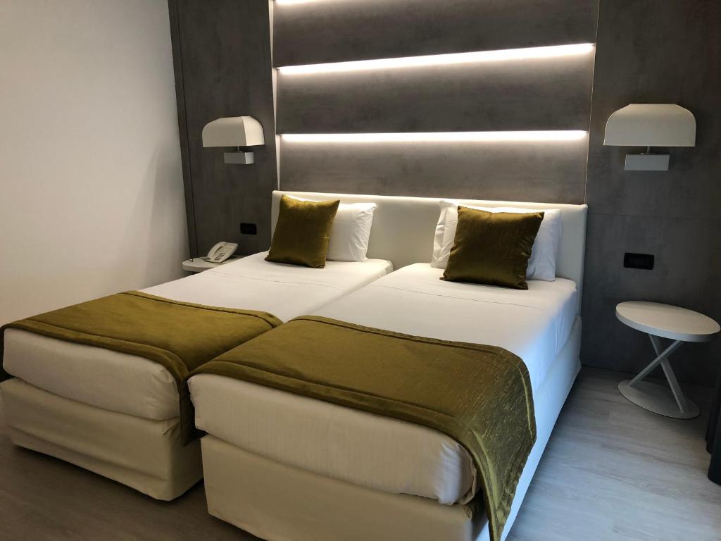 Postel nebo postele na pokoji v ubytování La Pieve Hotel