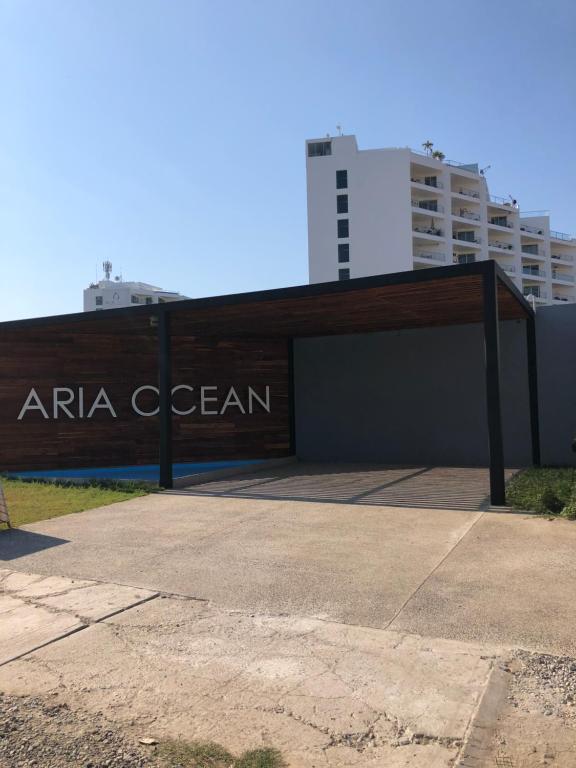 a building with a sign that readsarma ocean at Aria Ocean in Nuevo Vallarta