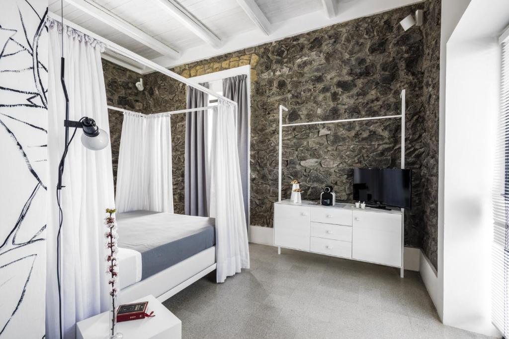 Postel nebo postele na pokoji v ubytování Masseria Guida