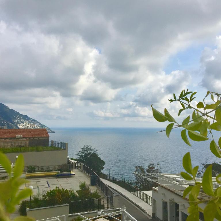 a view of the ocean from a building at Hotel Villa Delle Palme in Positano in Positano