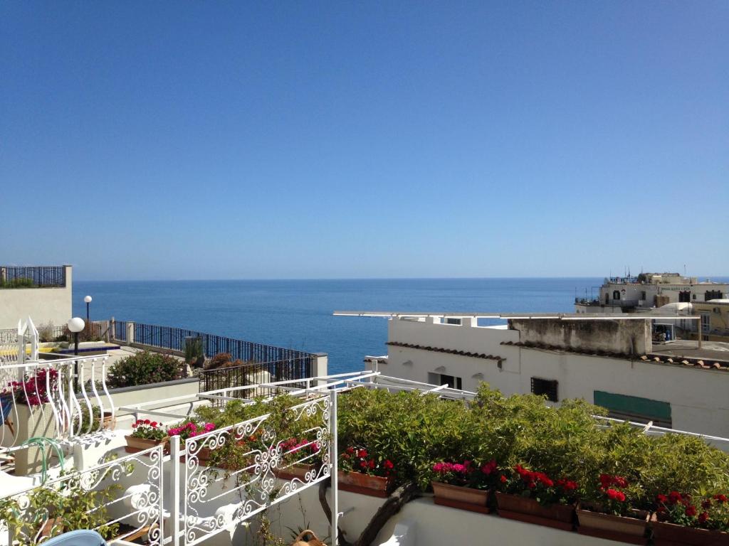 a view of the ocean from a building at Hotel Villa Delle Palme in Positano in Positano