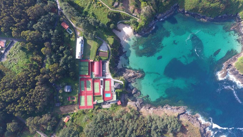 an aerial view of a building on the side of a lake at Apartamentos Canabal in A Coruña