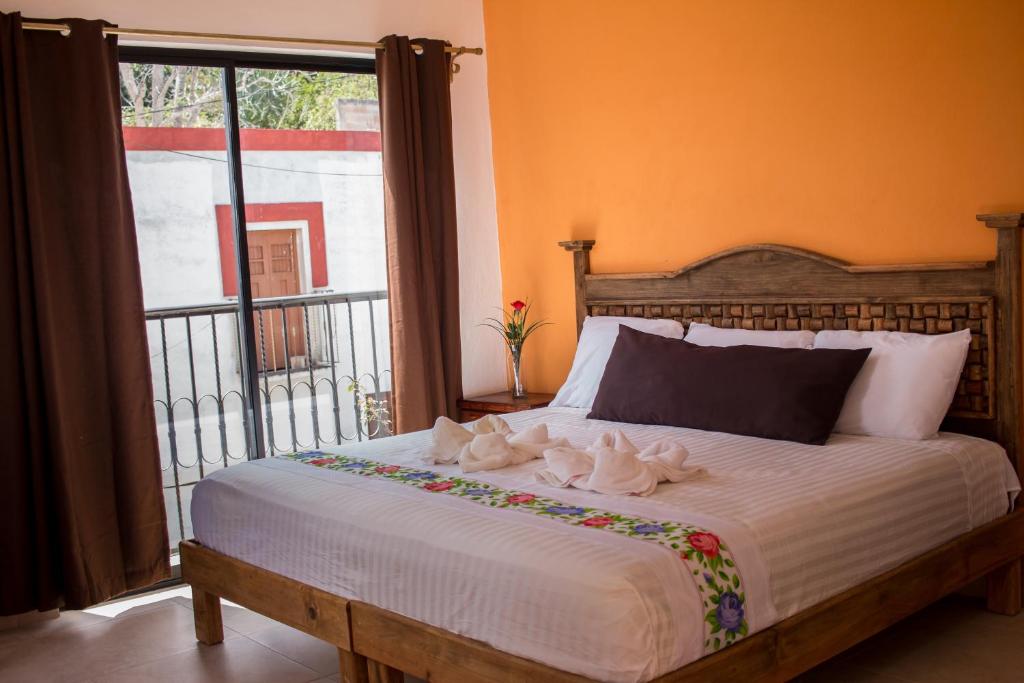 Postel nebo postele na pokoji v ubytování Hotel Real Colonial
