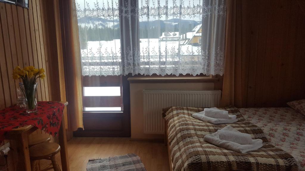 Posteľ alebo postele v izbe v ubytovaní Leśne Zacisze